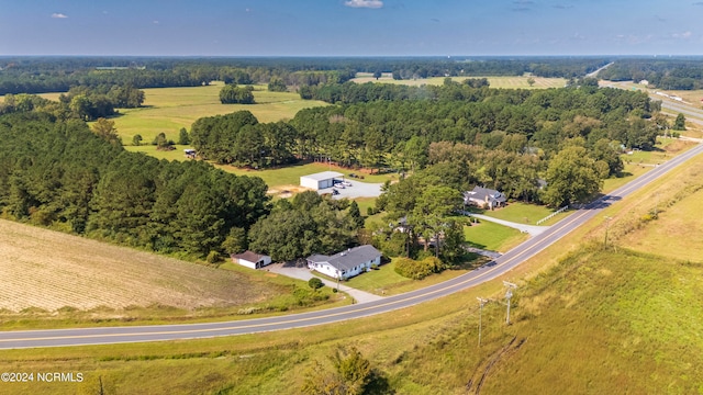 birds eye view of property with a rural view