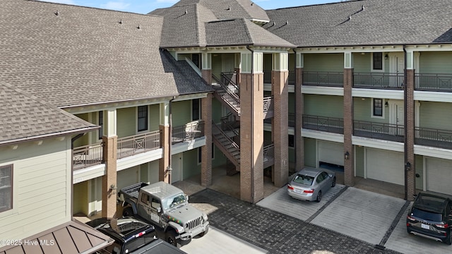 648 Village Park Dr Unit 203, Wilmington, NC 28405 - view of property with concrete driveway and stairway