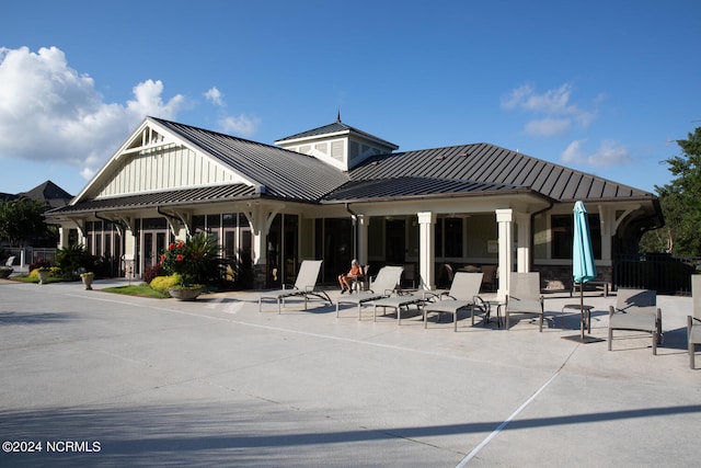 back of house with a patio