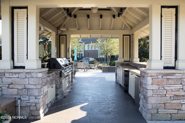 view of patio / terrace featuring a gazebo, area for grilling, and ceiling fan