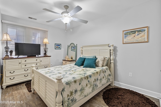 648 Village Park Dr Unit 203, Wilmington, NC 28405 - bedroom featuring dark wood-style flooring, baseboards, and a ceiling fan
