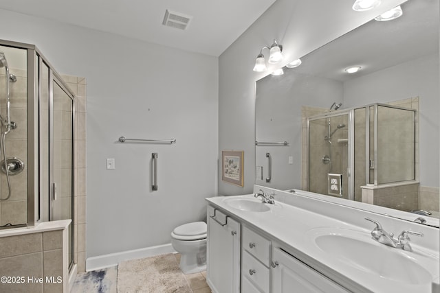 648 Village Park Dr Unit 203, Wilmington, NC 28405 - full bathroom featuring a stall shower, double vanity, toilet, tile patterned flooring, and baseboards