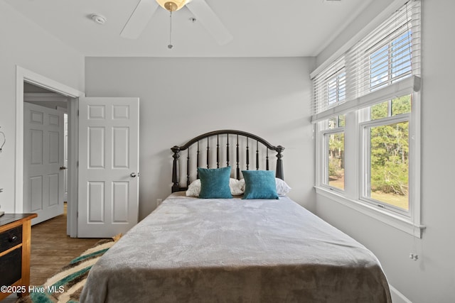 648 Village Park Dr Unit 203, Wilmington, NC 28405 - bedroom featuring wood finished floors, a ceiling fan, and baseboards
