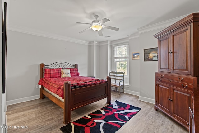 648 Village Park Dr Unit 203, Wilmington, NC 28405 - bedroom with baseboards, light wood-type flooring, crown molding, and a ceiling fan