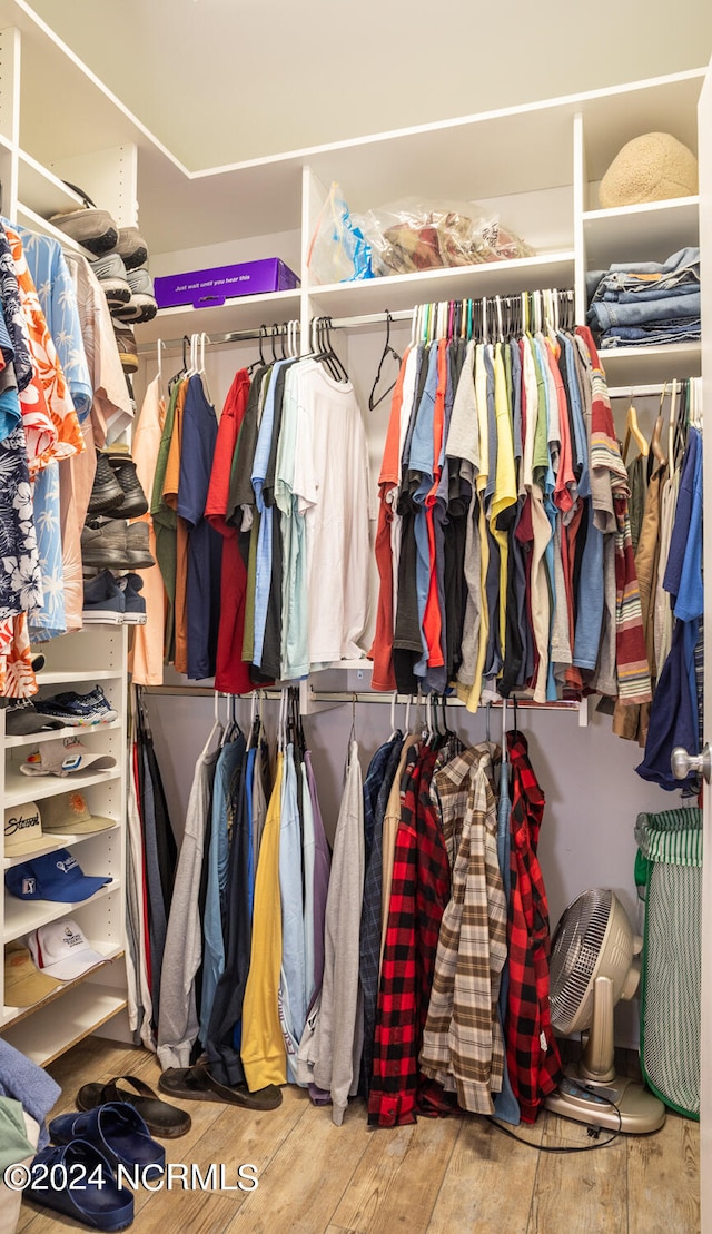 spacious closet featuring hardwood / wood-style flooring