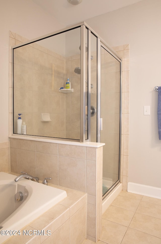 bathroom with tile patterned floors, sink, and independent shower and bath