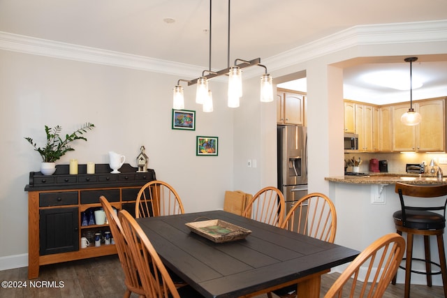 dining room featuring crown molding and dark hardwood / wood-style flooring