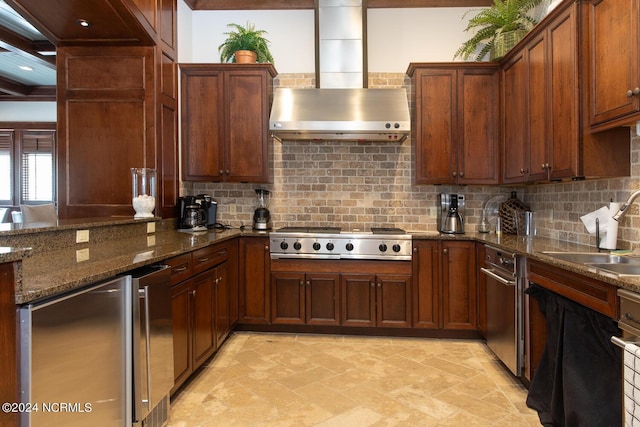 648 Village Park Dr Unit 203, Wilmington, NC 28405 - kitchen featuring wall chimney range hood, stainless steel gas cooktop, a sink, tasteful backsplash, and fridge