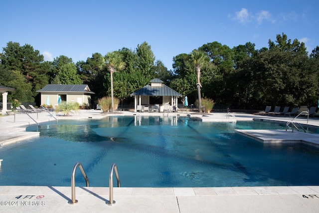 view of swimming pool featuring a patio area