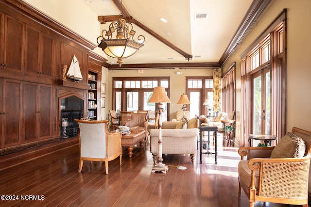 living room featuring lofted ceiling with beams, crown molding, and dark hardwood / wood-style floors