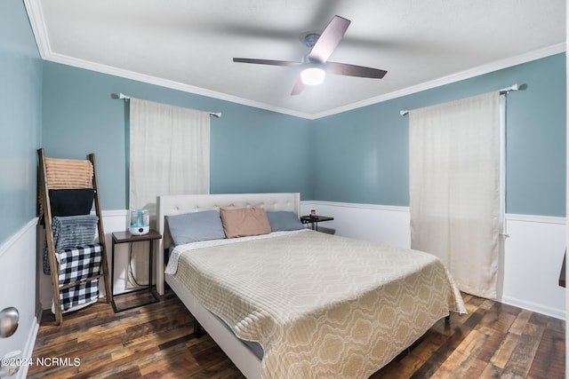 bedroom with ornamental molding, dark hardwood / wood-style floors, and ceiling fan