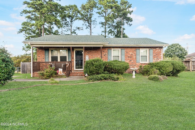 view of front of property with a porch and a front lawn