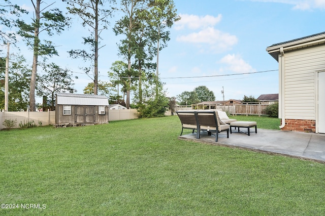 view of yard featuring a storage shed and a patio