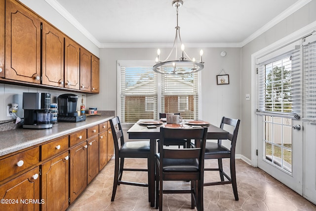 dining room with an inviting chandelier and ornamental molding