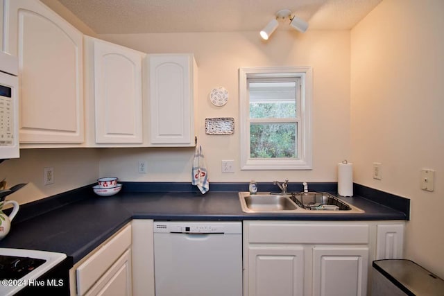 kitchen featuring white cabinetry, white appliances, sink, and a textured ceiling