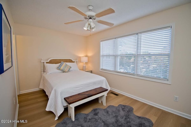 bedroom featuring wood-type flooring and ceiling fan