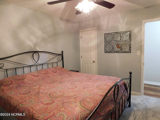 bedroom with ceiling fan and carpet floors