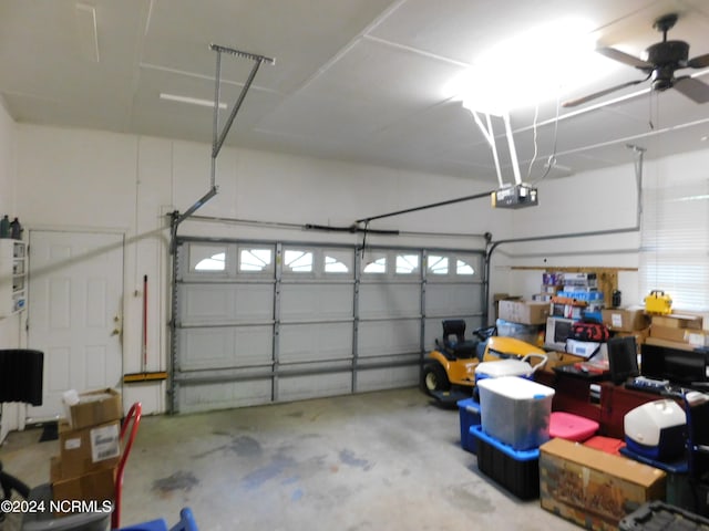 garage featuring a garage door opener and ceiling fan