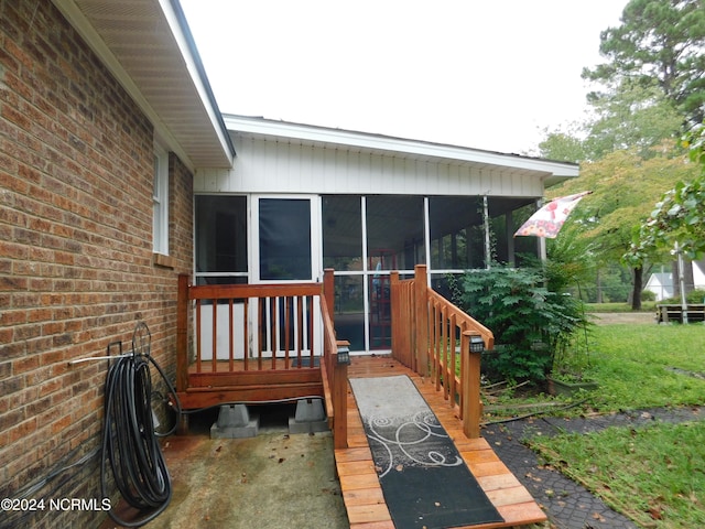 deck with a sunroom