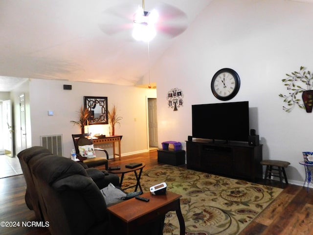 living room with hardwood / wood-style floors, ceiling fan, and high vaulted ceiling