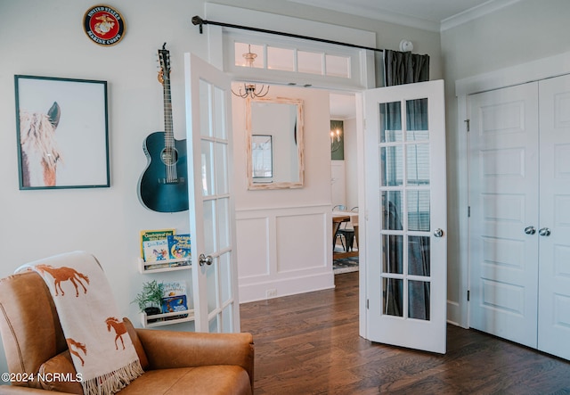 sitting room featuring crown molding, dark hardwood / wood-style flooring, and french doors