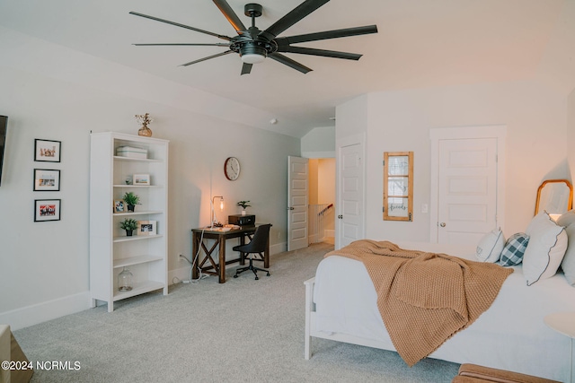 bedroom with light carpet, vaulted ceiling, and ceiling fan