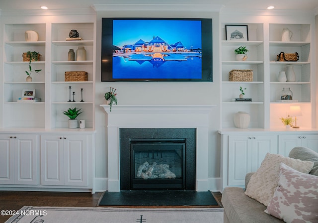 living room with crown molding and dark hardwood / wood-style floors