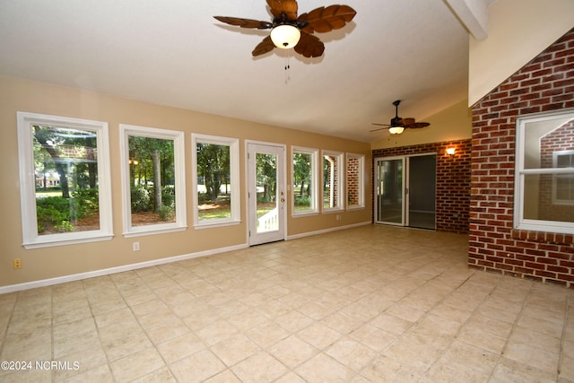 unfurnished living room with lofted ceiling and ceiling fan