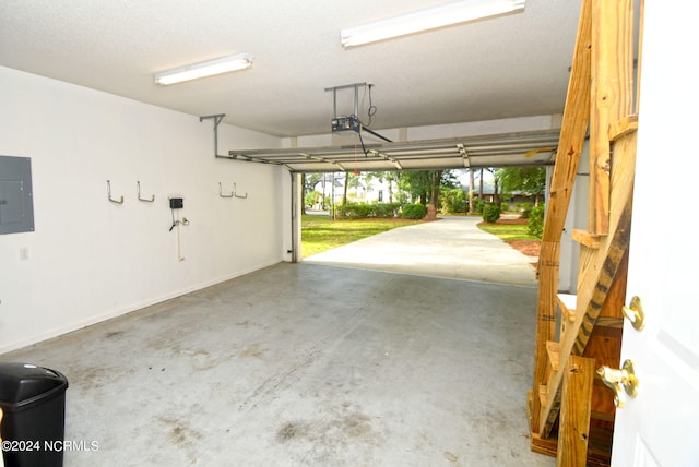 garage featuring a garage door opener and electric panel