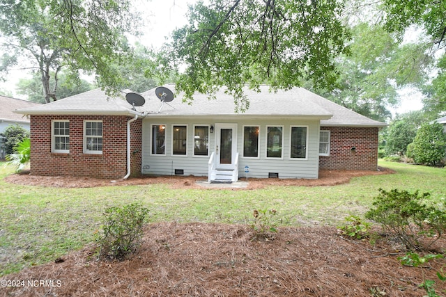 ranch-style home with a front yard