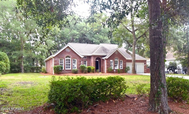 single story home with a garage and a front lawn