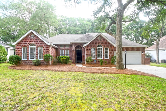 ranch-style home with cooling unit, a garage, and a front lawn