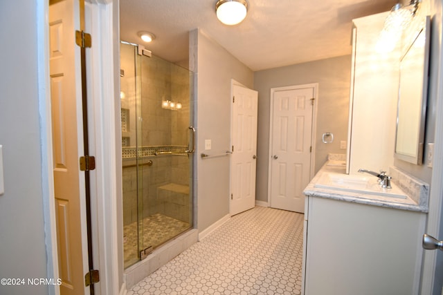 bathroom with vanity and an enclosed shower