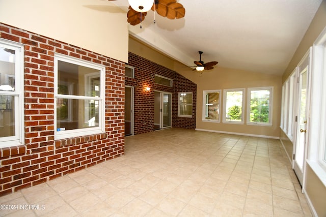 unfurnished sunroom with ceiling fan and lofted ceiling