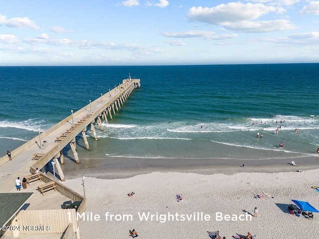 bird's eye view featuring a view of the beach and a water view