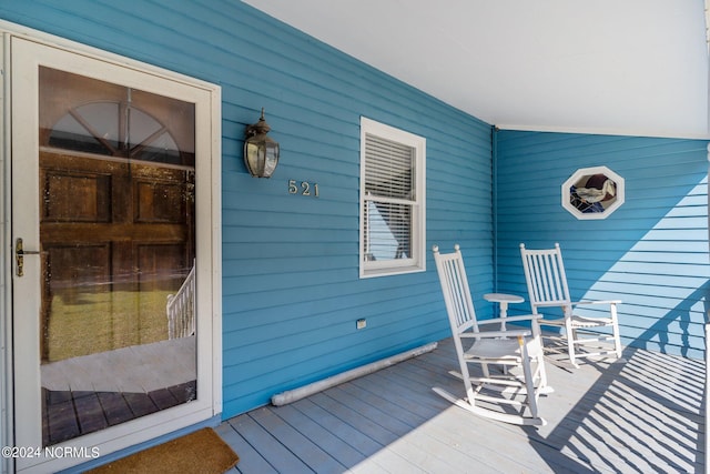 wooden terrace with a porch