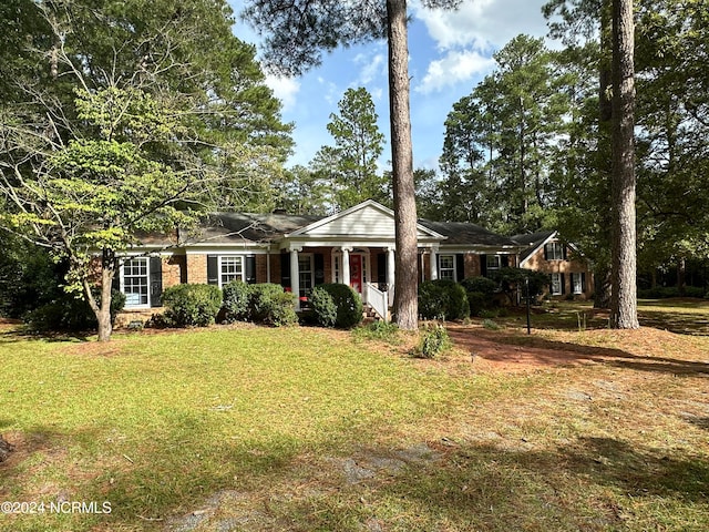 ranch-style home with a front yard