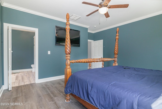 bedroom with hardwood / wood-style flooring, ceiling fan, ornamental molding, and connected bathroom