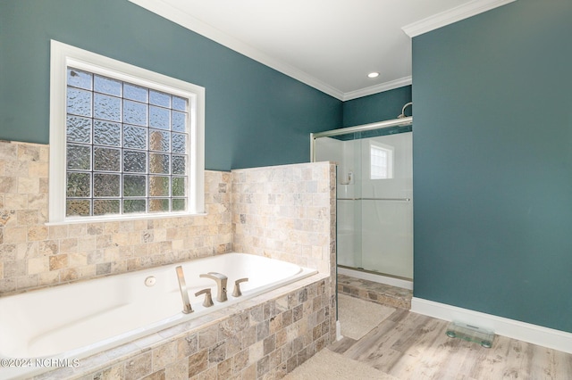 bathroom with wood-type flooring, separate shower and tub, a wealth of natural light, and crown molding