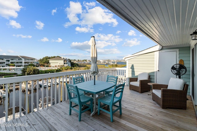 wooden deck with a water view