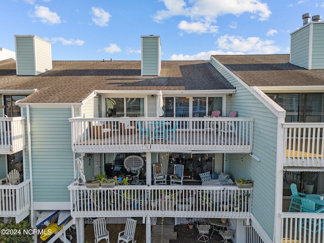 back of property featuring a balcony