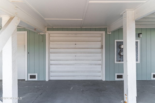 garage with wood walls