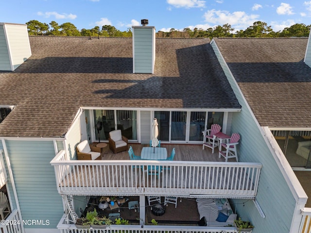 rear view of house featuring a balcony