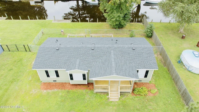 birds eye view of property with a water view