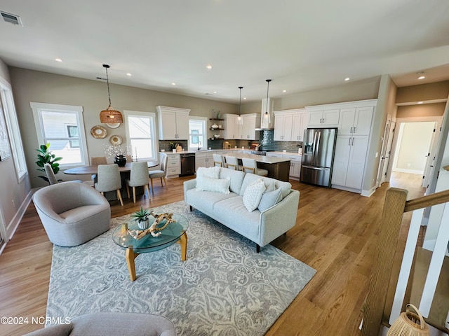 living room with light hardwood / wood-style floors