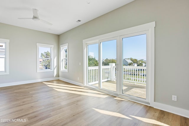 unfurnished room with light hardwood / wood-style flooring and ceiling fan