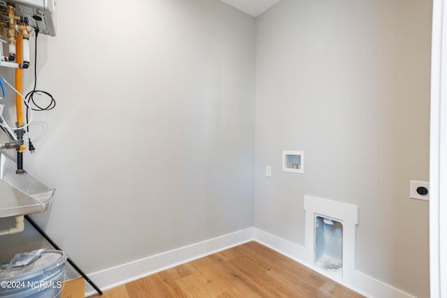 laundry room featuring hookup for a washing machine, wood-type flooring, and hookup for an electric dryer