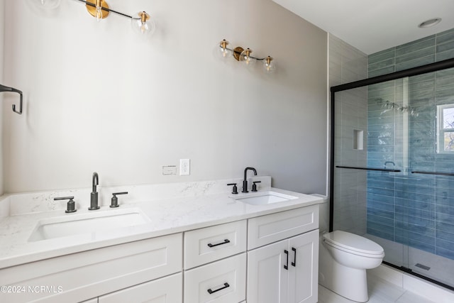 bathroom featuring vanity, toilet, an enclosed shower, and tile patterned flooring