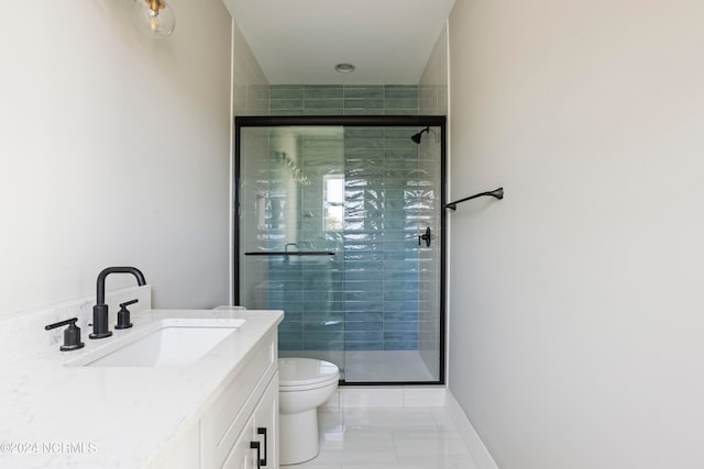 bathroom with vanity, an enclosed shower, and toilet