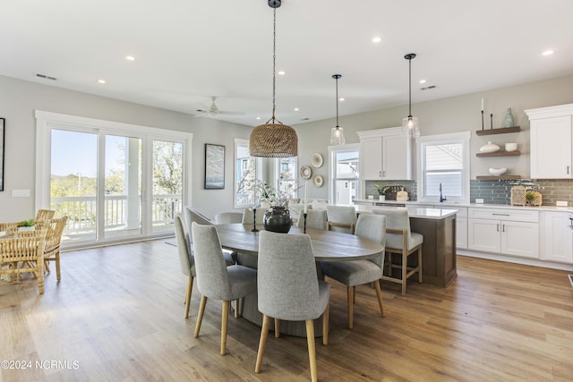 dining area with visible vents, light wood-style floors, ceiling fan, and recessed lighting